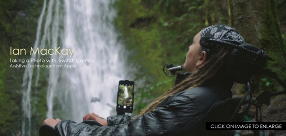 Ian MacKay, in a wheelchair with an iPhone camera pointed towards a waterfall. The text in the image reads" Taking a Photo with Switch Control Assistive Technology from Apple."